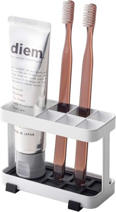Picture of YAMAZAKI Home Tower Toothbrush and Toothpaste Holder for Bathroom Countertop - Steel | Durable steel stand designed for bathroom countertops. A smart fit for modern homes. Helps keep everyday spaces organized.