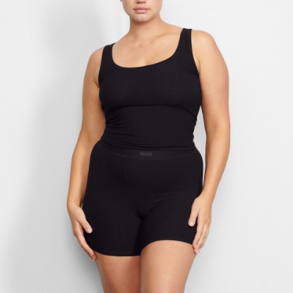 WORN BY A MODEL IN FRONT VIEW SOFT LOUNGE TANK IN ONYX